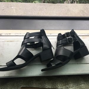 Fashionable black shoes with buckles